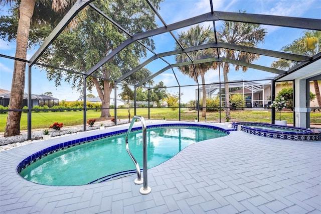 2442 Rio De Janeiro Ave, Punta Gorda, FL 33983 - view of pool with a pool with connected hot tub, a lawn, a patio, and a lanai