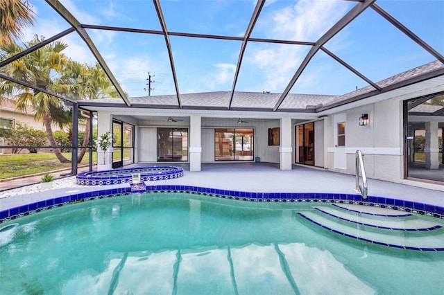 2442 Rio De Janeiro Ave, Punta Gorda, FL 33983 - view of pool with ceiling fan, a patio, glass enclosure, and a pool with connected hot tub