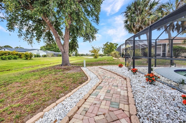 2442 Rio De Janeiro Ave, Punta Gorda, FL 33983 - view of green lawn with a lanai