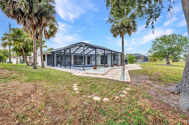2442 Rio De Janeiro Ave, Punta Gorda, FL 33983 - rear view of property featuring a pool, a yard, and a lanai