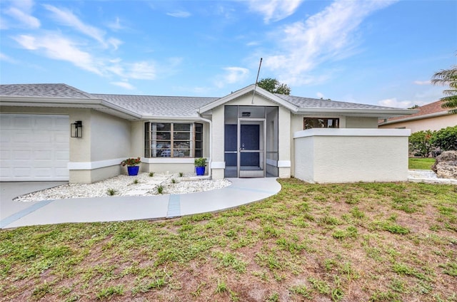 2442 Rio De Janeiro Ave, Punta Gorda, FL 33983 - view of front of home featuring stucco siding and a garage