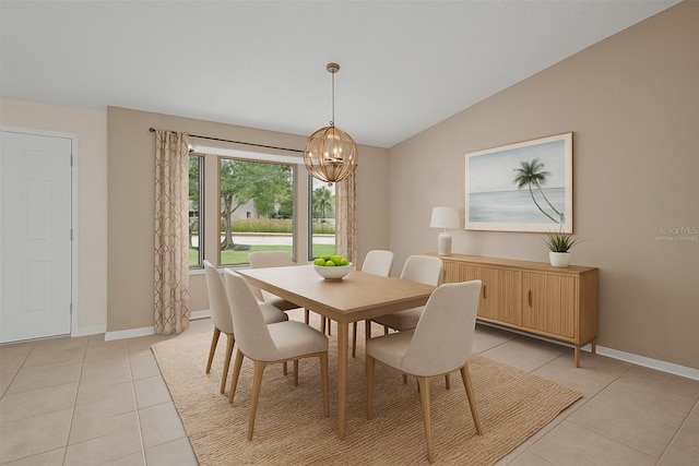 2442 Rio De Janeiro Ave, Punta Gorda, FL 33983 - dining area featuring light tile patterned flooring, a chandelier, lofted ceiling, and baseboards