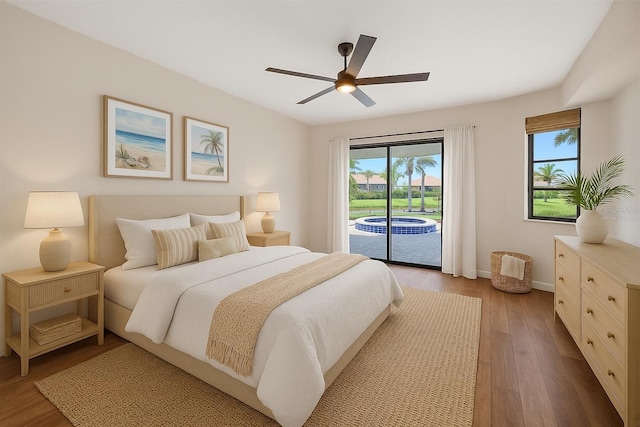 2442 Rio De Janeiro Ave, Punta Gorda, FL 33983 - bedroom featuring access to exterior, wood finished floors, baseboards, and a ceiling fan