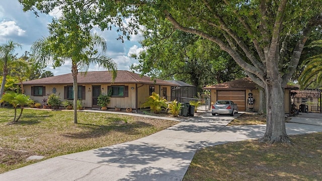 4071 Dekle Ave, North Port, FL 34286 - ranch-style house with a front yard, concrete driveway, an attached garage, and a lanai