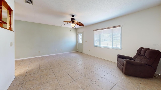 4071 Dekle Ave, North Port, FL 34286 - living area featuring a ceiling fan and light tile patterned flooring