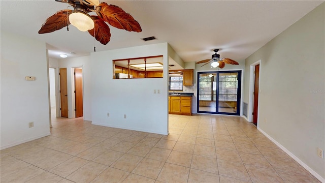 4071 Dekle Ave, North Port, FL 34286 - unfurnished living room featuring ceiling fan and light tile patterned floors