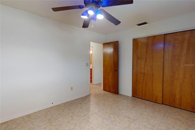 4071 Dekle Ave, North Port, FL 34286 - unfurnished bedroom with a closet, a ceiling fan, and light tile patterned floors