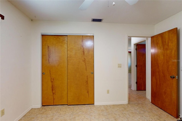 4071 Dekle Ave, North Port, FL 34286 - unfurnished bedroom featuring a closet, ceiling fan, and light tile patterned flooring