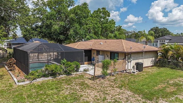 4071 Dekle Ave, North Port, FL 34286 - rear view of property featuring an outdoor pool and glass enclosure