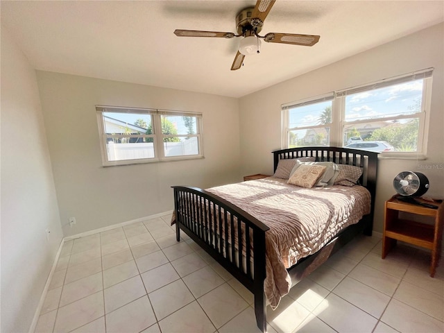 3122 Scranton St, Port Charlotte, FL 33952 - bedroom with multiple windows, light tile patterned floors, ceiling fan, and baseboards