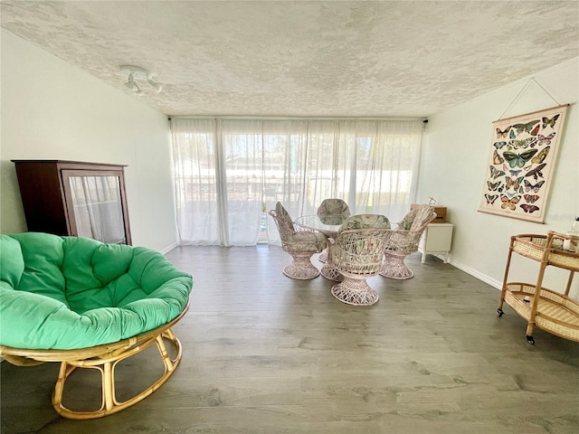 3122 Scranton St, Port Charlotte, FL 33952 - dining space featuring a textured ceiling, baseboards, and wood finished floors