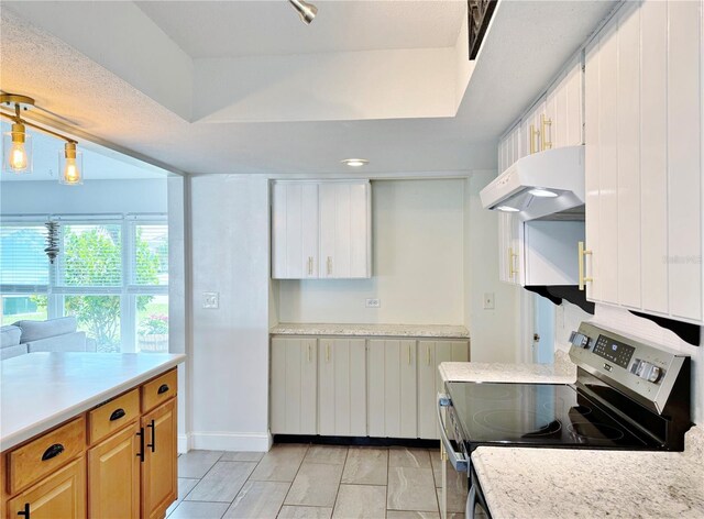 3122 Scranton St, Port Charlotte, FL 33952 - kitchen featuring electric range, under cabinet range hood, and light countertops