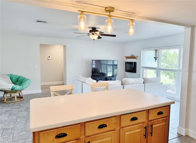 3122 Scranton St, Port Charlotte, FL 33952 - kitchen featuring a ceiling fan, open floor plan, light countertops, and hanging light fixtures