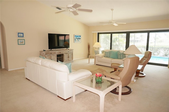 3398 Tripoli Blvd, Punta Gorda, FL 33950 - living area featuring light colored carpet, a ceiling fan, lofted ceiling, baseboards, and arched walkways