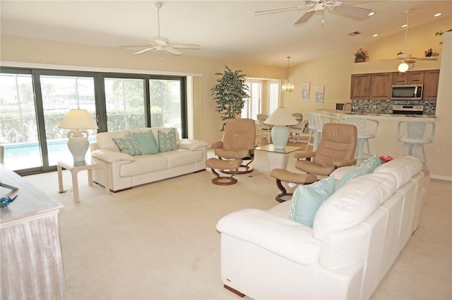 3398 Tripoli Blvd, Punta Gorda, FL 33950 - living room featuring a ceiling fan, light carpet, lofted ceiling, and a chandelier