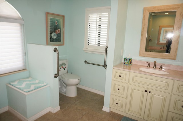 3398 Tripoli Blvd, Punta Gorda, FL 33950 - bathroom with toilet, baseboards, vanity, and tile patterned flooring