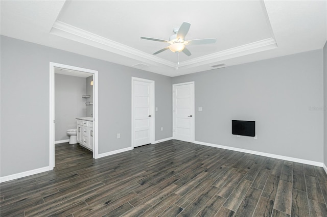 5532 Veracruz Ter, Port Charlotte, FL 33981 - unfurnished bedroom featuring a raised ceiling, dark wood finished floors, ornamental molding, and baseboards