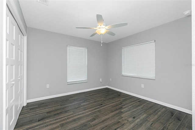5532 Veracruz Ter, Port Charlotte, FL 33981 - unfurnished bedroom featuring a closet, dark wood-style floors, and baseboards