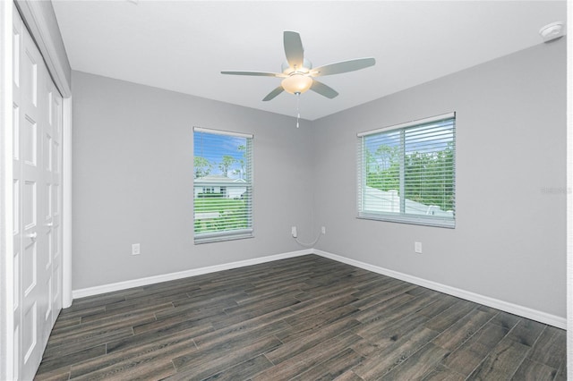 5532 Veracruz Ter, Port Charlotte, FL 33981 - spare room featuring dark wood-style flooring, baseboards, ceiling fan, and a smoke detector
