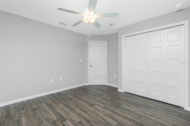 5532 Veracruz Ter, Port Charlotte, FL 33981 - unfurnished bedroom with dark wood-type flooring, baseboards, a closet, and ceiling fan