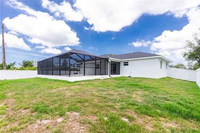 5532 Veracruz Ter, Port Charlotte, FL 33981 - back of property featuring a gate, glass enclosure, and stucco siding
