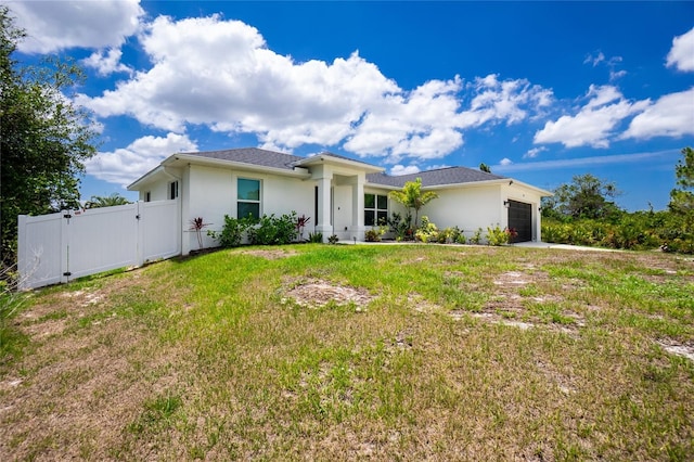 5532 Veracruz Ter, Port Charlotte, FL 33981 - view of front of house featuring a gate, an attached garage, and stucco siding