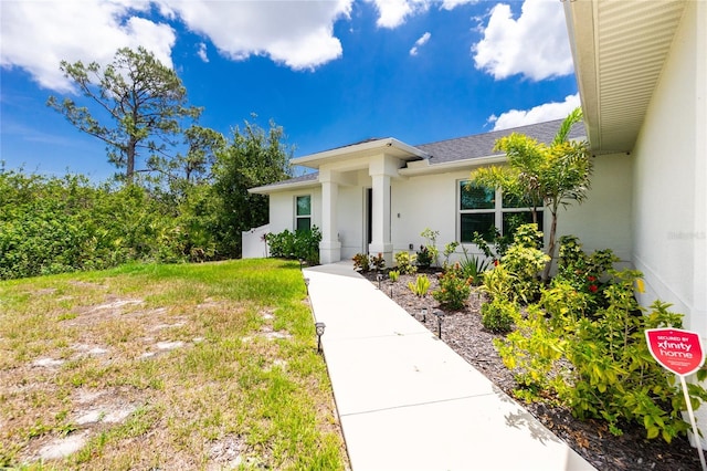 5532 Veracruz Ter, Port Charlotte, FL 33981 - property entrance featuring stucco siding and a shingled roof