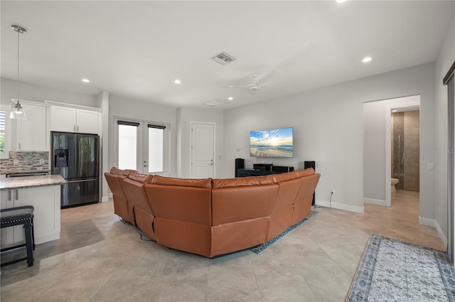 3302 Palm Dr, Punta Gorda, FL 33950 - living area with recessed lighting, ceiling fan, baseboards, french doors, and light tile patterned flooring