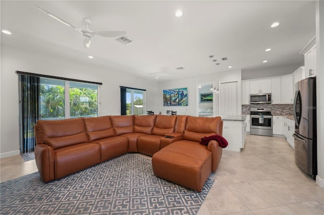 3302 Palm Dr, Punta Gorda, FL 33950 - living room featuring recessed lighting, ceiling fan, and light tile patterned floors