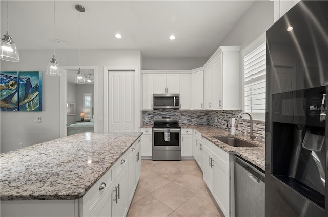 3302 Palm Dr, Punta Gorda, FL 33950 - kitchen featuring stainless steel appliances, a sink, backsplash, healthy amount of natural light, and recessed lighting