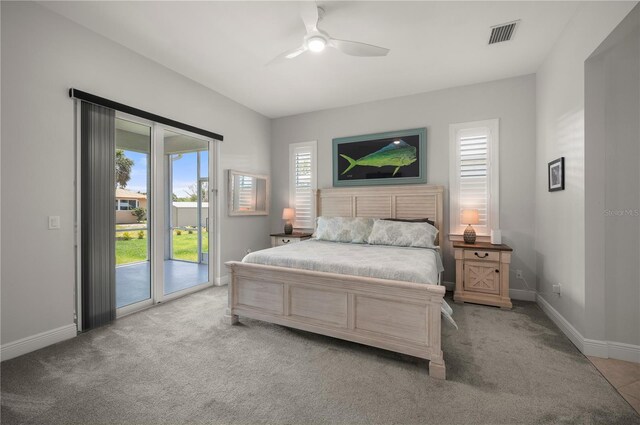 3302 Palm Dr, Punta Gorda, FL 33950 - bedroom with access to exterior, light colored carpet, baseboards, and a ceiling fan