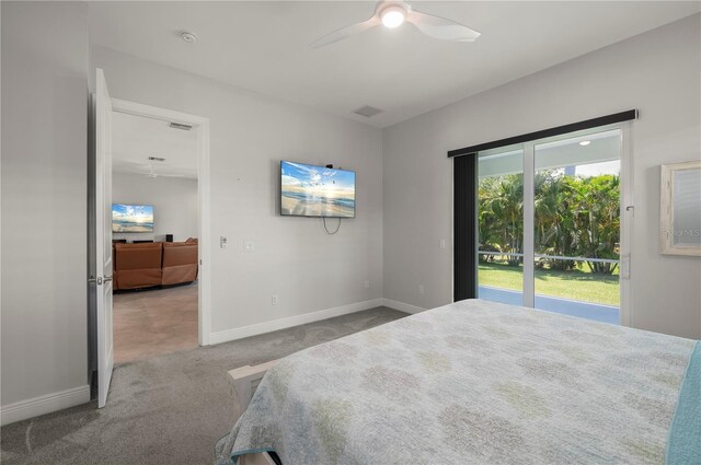 3302 Palm Dr, Punta Gorda, FL 33950 - carpeted bedroom featuring baseboards, access to outside, and a ceiling fan