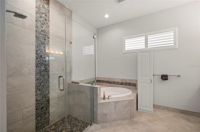 3302 Palm Dr, Punta Gorda, FL 33950 - bathroom featuring a garden tub, a stall shower, tile patterned flooring, and baseboards