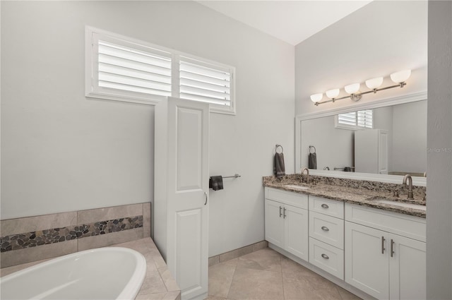 3302 Palm Dr, Punta Gorda, FL 33950 - bathroom featuring double vanity and a garden tub