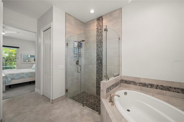 3302 Palm Dr, Punta Gorda, FL 33950 - ensuite bathroom with a garden tub, a shower stall, tile patterned flooring, recessed lighting, and a ceiling fan