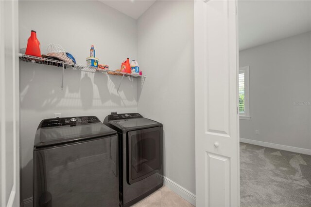 3302 Palm Dr, Punta Gorda, FL 33950 - washroom featuring washing machine and clothes dryer and baseboards