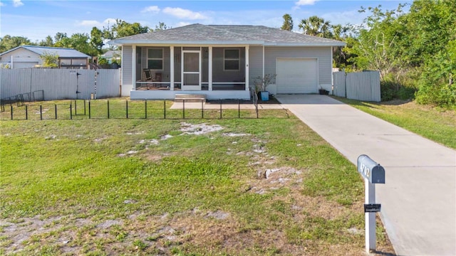 4702 Westwood Dr, Punta Gorda, FL 33982 - ranch-style house featuring an attached garage, a sunroom, concrete driveway, and a shingled roof