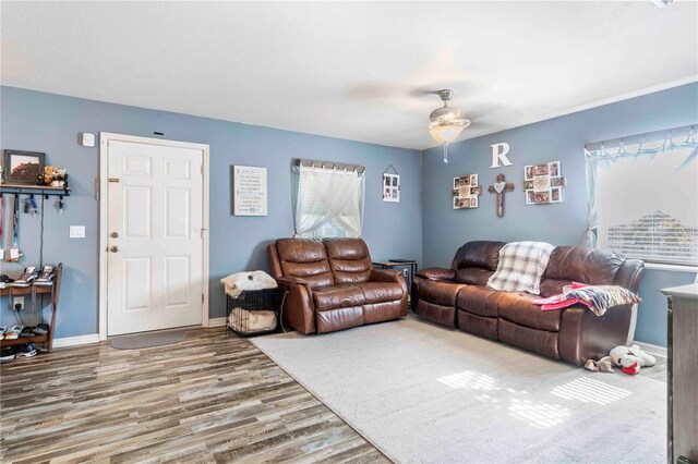 4702 Westwood Dr, Punta Gorda, FL 33982 - living area featuring wood finished floors, ceiling fan, and baseboards