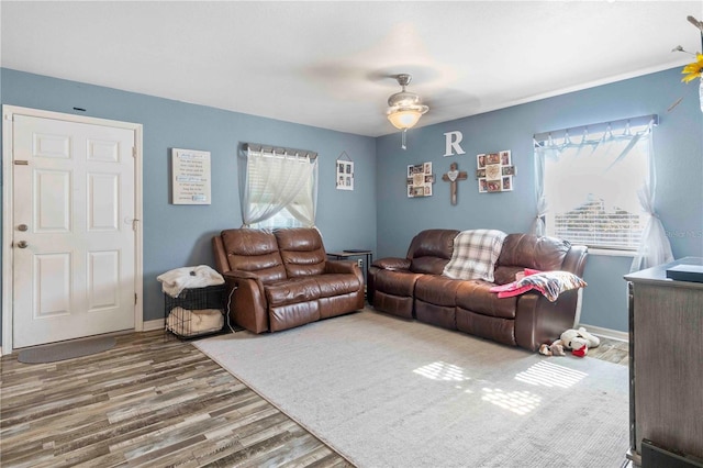 4702 Westwood Dr, Punta Gorda, FL 33982 - living room with plenty of natural light, wood finished floors, ceiling fan, and baseboards