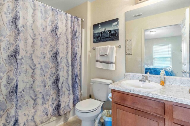 4702 Westwood Dr, Punta Gorda, FL 33982 - full bathroom with vanity, toilet, and a shower with shower curtain