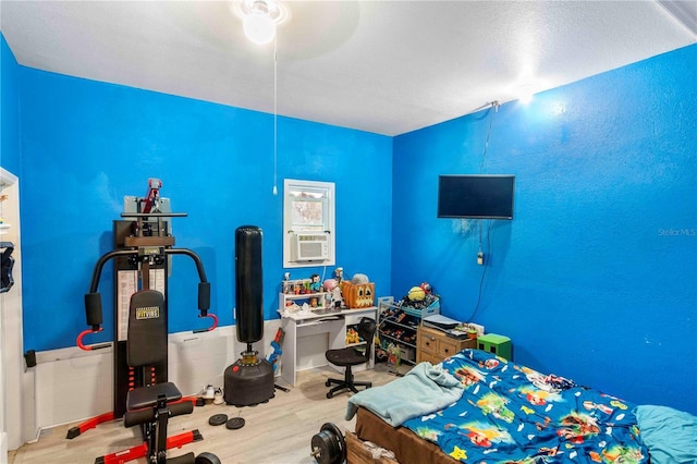 4702 Westwood Dr, Punta Gorda, FL 33982 - bedroom with wood finished floors and cooling unit