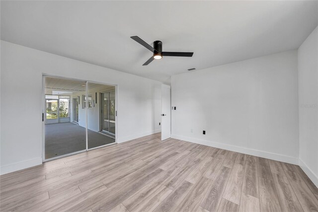 2166 Beacon Dr, Port Charlotte, FL 33952 - unfurnished bedroom with light wood-type flooring, baseboards, and ceiling fan