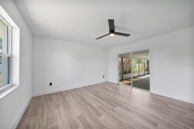 2166 Beacon Dr, Port Charlotte, FL 33952 - spare room with light wood-style floors, ceiling fan, and baseboards