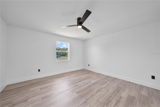 2166 Beacon Dr, Port Charlotte, FL 33952 - empty room with a ceiling fan, light wood-style flooring, and baseboards