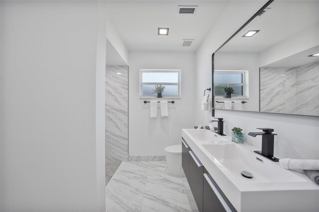 2166 Beacon Dr, Port Charlotte, FL 33952 - full bathroom with marble look tiles, toilet, walk in shower, and double vanity