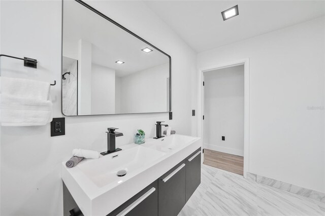 2166 Beacon Dr, Port Charlotte, FL 33952 - full bath with double vanity and baseboards