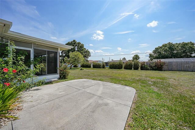 2166 Beacon Dr, Port Charlotte, FL 33952 - view of yard with a patio and a sunroom