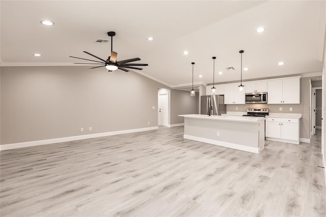 16280 Minorca Dr, Punta Gorda, FL 33955 - kitchen with appliances with stainless steel finishes, ornamental molding, light countertops, a kitchen island with sink, and open floor plan