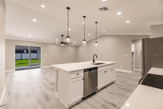 16280 Minorca Dr, Punta Gorda, FL 33955 - kitchen with stainless steel appliances, a sink, ornamental molding, baseboards, and light wood finished floors