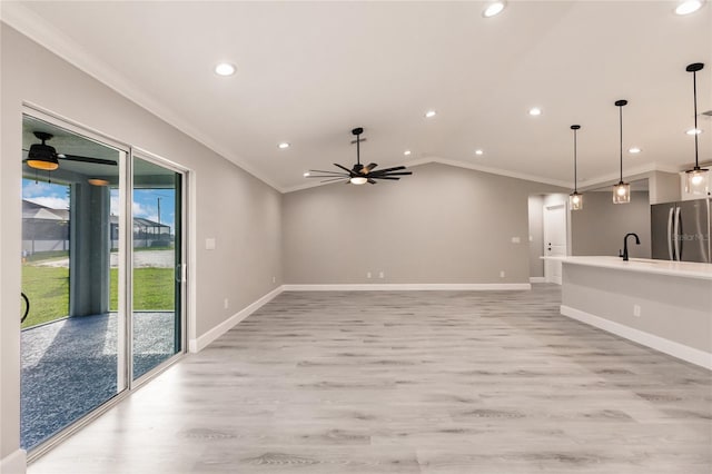 16280 Minorca Dr, Punta Gorda, FL 33955 - unfurnished living room with ornamental molding, a ceiling fan, light wood-style floors, baseboards, and recessed lighting